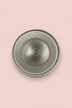 Metallic sink strainer on a light gray background