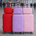 Hello Kitty Kids Luggage Set in hot pink, lavender, and aqua with hard shell spinner suitcases and matching top travel cases at airport terminal
