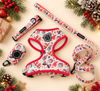 Flat lay of the Merry Paws Christmas walking set: harness, collar, leash and poop bag holder with holiday decor