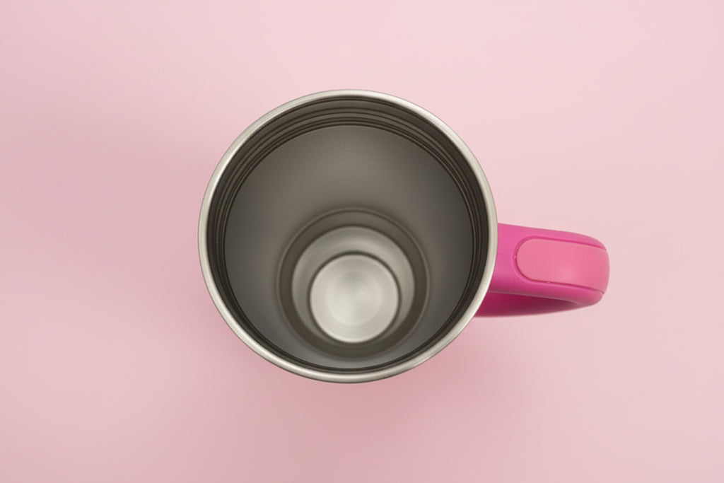 Pink mug with a metallic interior on a pink background
