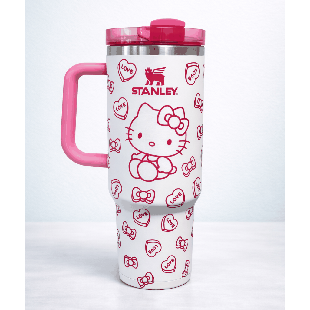 Pink and white Stanley Hello Kitty travel mug with love heart design