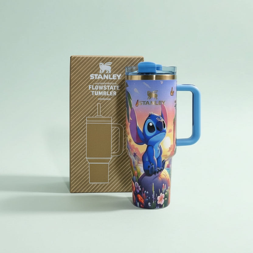 Colorful tumbler with a character design next to its packaging on a light gray background