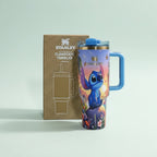 Colorful tumbler with a character design next to its packaging on a light gray background