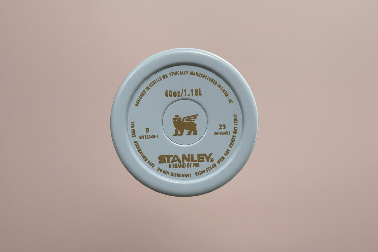 Close-up of a Stanley water bottle cap on a neutral background