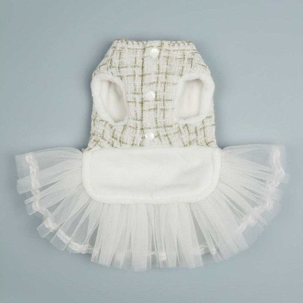 White Chanel-style tweed dog dress showing front view with pearl buttons and luxury pet fashion design