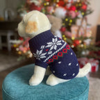 Navy blue snowflake dog sweater with red hearts and Nordic knit pattern on a dog mannequin.