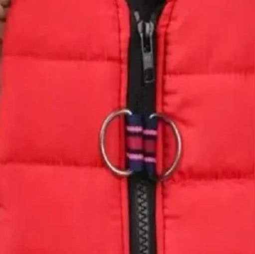 Close-up of red quilted dog vest showing diamond quilted pattern and waterproof fabric detail