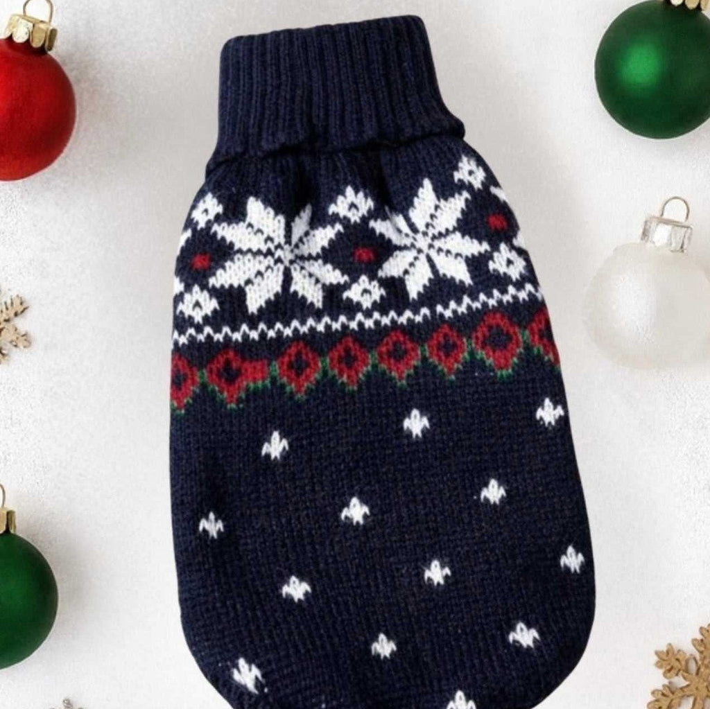 Navy blue snowflake dog sweater flat lay showing Fair Isle holiday knit with red hearts pattern