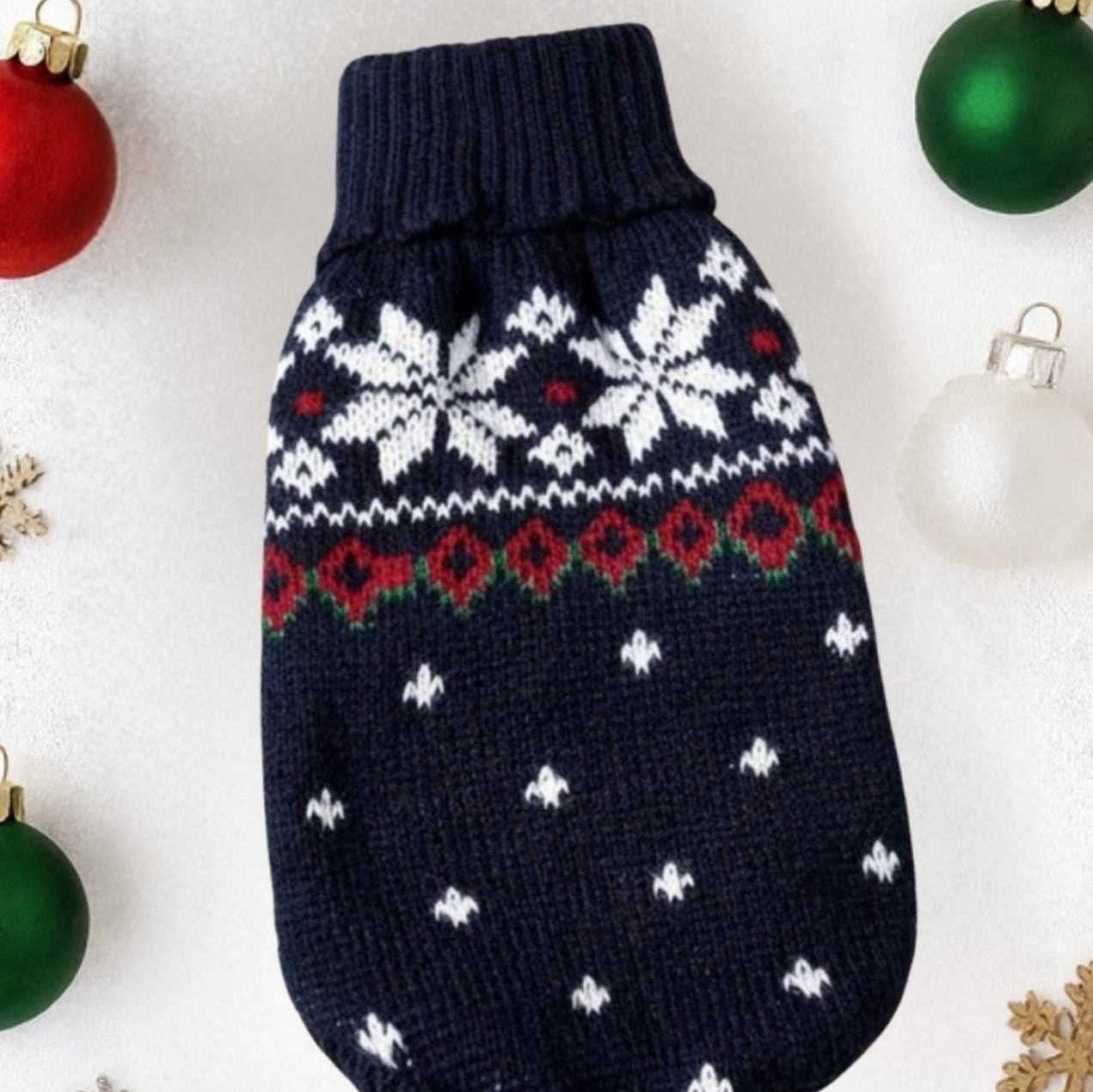 Navy blue snowflake dog sweater flat lay showing Fair Isle holiday knit with red hearts pattern