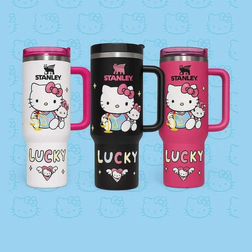 kawaii kitty 40oz tumbler with handle in white black and pink colors featuring Hello Kitty artwork and Stanley logo