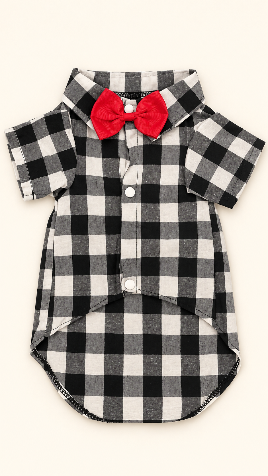 Buffalo check dog shirt front view with red bow tie on cream background
