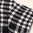 Macro close-up of the black and white houndstooth woven texture