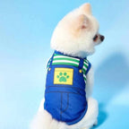 small dog wearing green cartoon overalls style dog shirt from 2-pack set