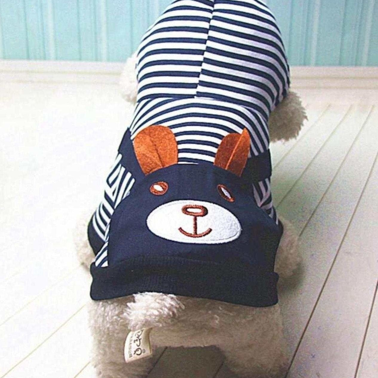mall dog wearing navy and white striped sailor dog hoodie, bunny pocket centered on the back