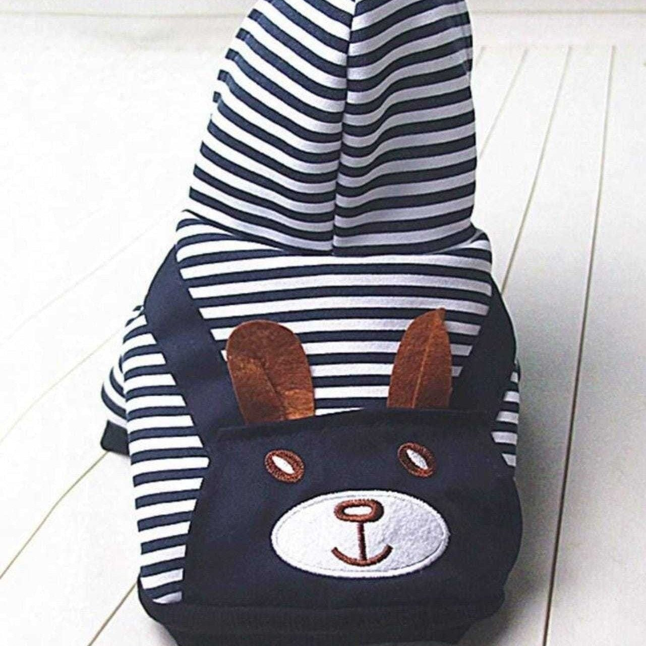 Back view of navy and white striped sailor dog hoodie with hood and bunny face pocket.