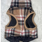 Close-up of back side on padded plaid fabric on dog harness jacket