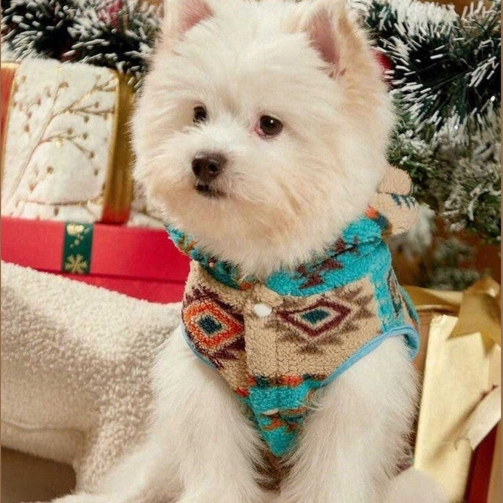 Side view of small dog wearing Aztec Fleece Dog Hoodie on a couch.