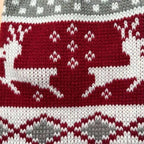 Reindeer knit dog sweater showing side view of red and grey holiday pattern