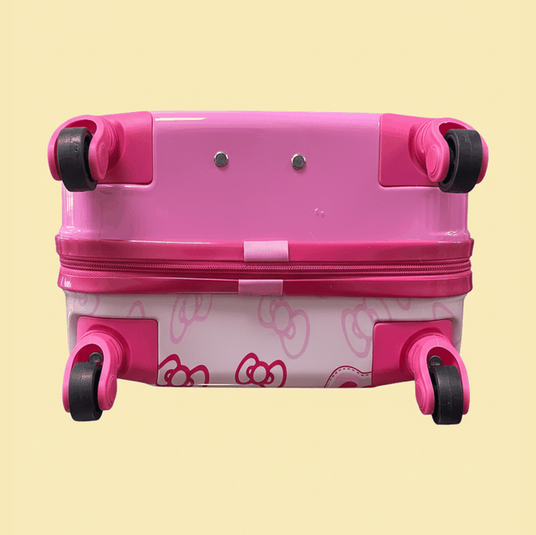 Hello Kitty rolling suitcase showing telescoping handle and durable hardshell construction with teddy bear desig
