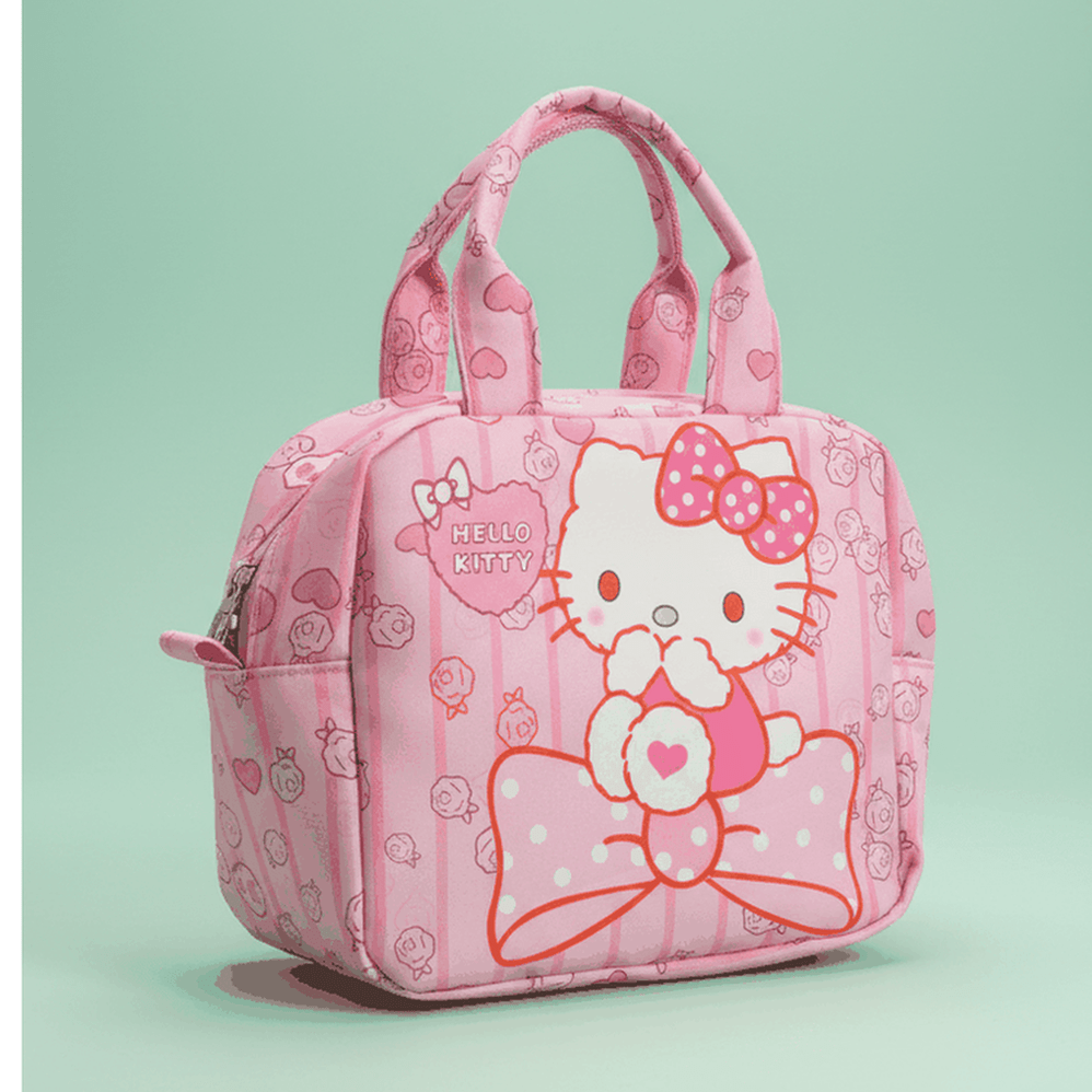 Hello Kitty insulated lunch bag with large Hello Kitty face and pink polka dot bow on seafoam green background
