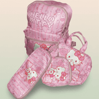 Official Sanrio Hello Kitty pink backpack, lunch bag and pencil case 3-piece set with bow pattern and rose gold accents on cream ivory and sage green background