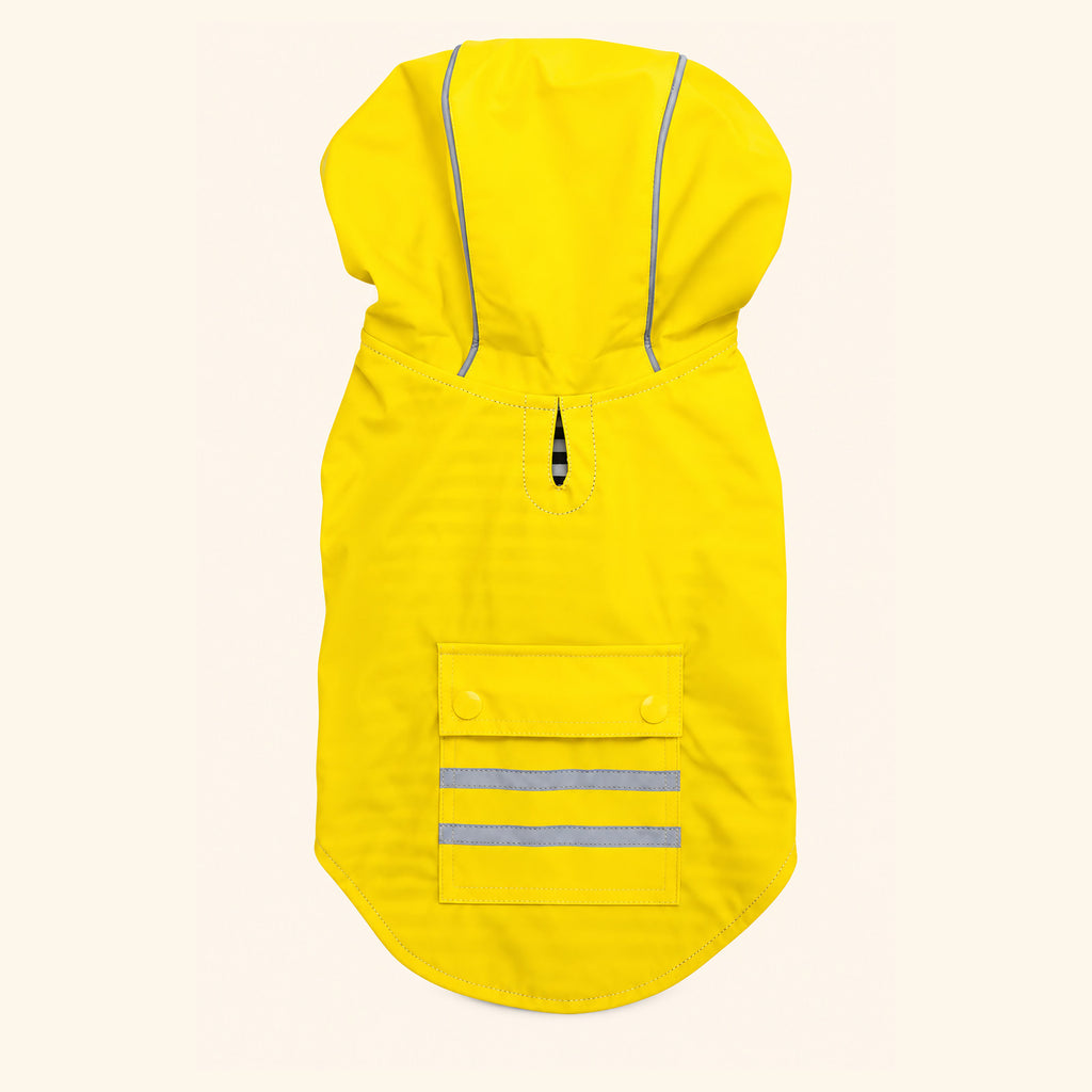 Yellow Slicker dog raincoat laid flat, back view showing the leash hole at the neck and the snap-close pocket