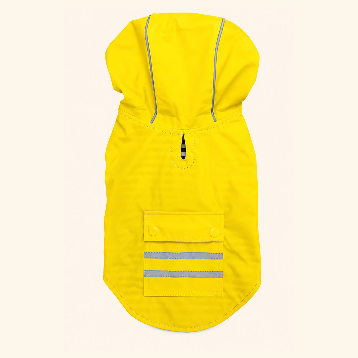 Yellow Slicker dog raincoat laid flat, back view showing the leash hole at the neck and the snap-close pocket